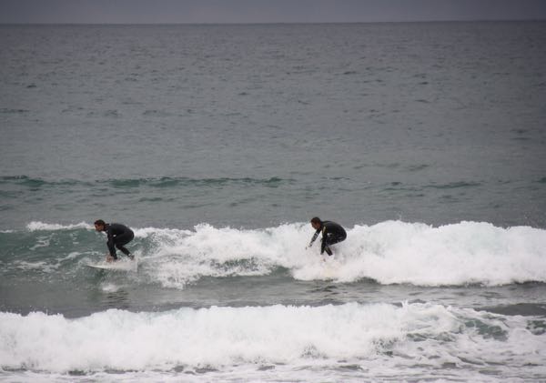 Surfers in Biarritz, France. Active boomer