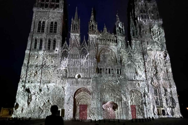 Surface of the moon projected onto Cathedral Notre-Dame de Rouen