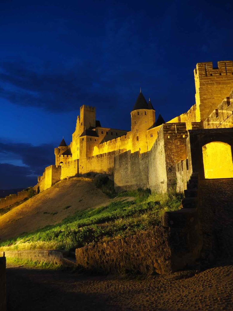Photo of the outer walls of La Cite Carcassonne at night.